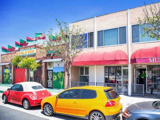 Massage Therapy Clinic Street View with Colorful Cars